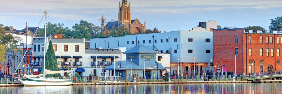 Shops and a sailboat along the coast in Wilmington, North Carolina
