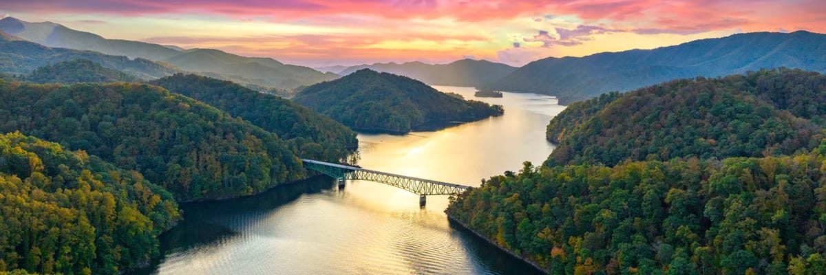 river at sunset surrounded by trees at sunset near tri-cities, TN