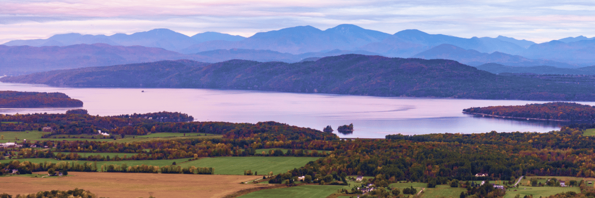 overlook of fall foilage and lake in Burlington, VT at sunset