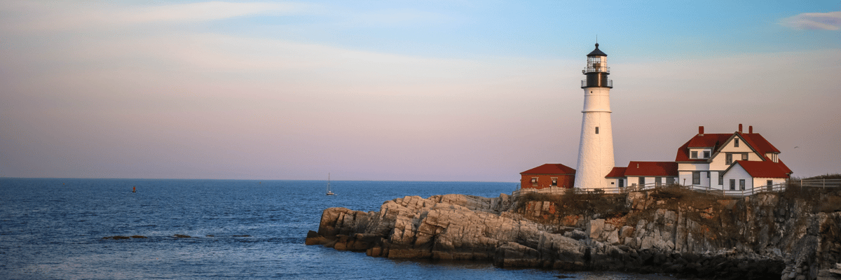 lighthouse looking over the ocean at sunset in Portland, Maine