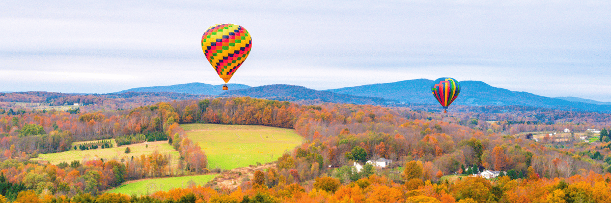 hot air balloons floating over fall leaves in Scranton, Pennsylvania