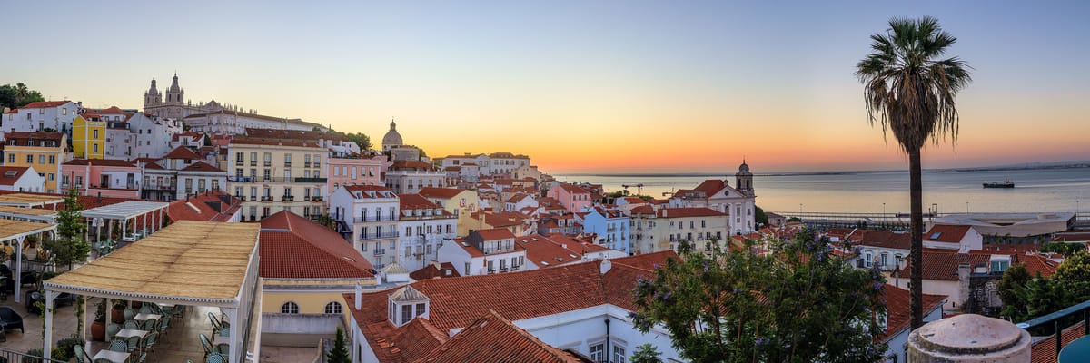 A panoramic view of Lisbon, Portugal taken from a viewpoint in the historic Alfama district.