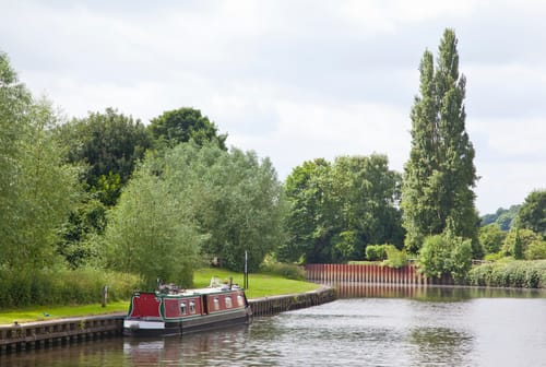 Shropshire Union Canal, surrounded by lush green trees and a calm waterway near Doncaster, UK