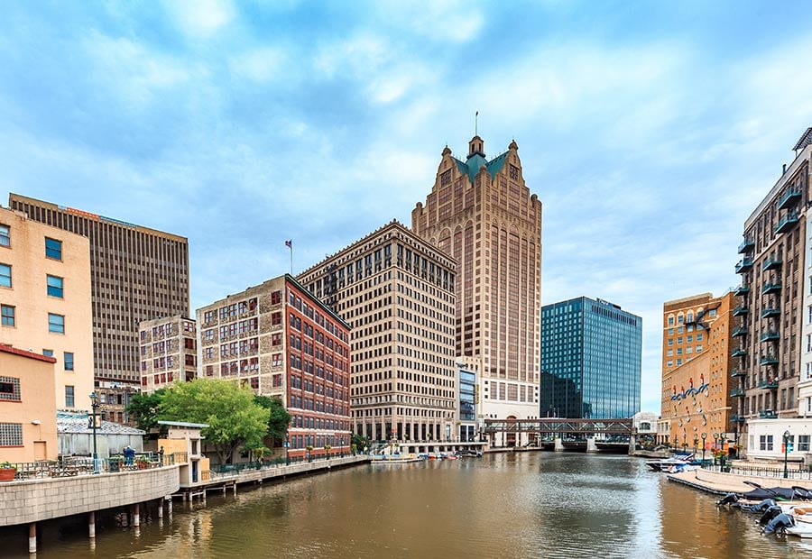 Milwaukee River lined with downtown buildings in Milwaukee, Wisconsin.