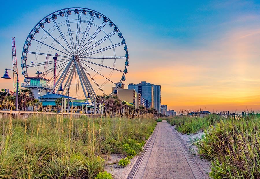 Myrtle Beach SkyWheel overlooking the beachfront at sunset.
