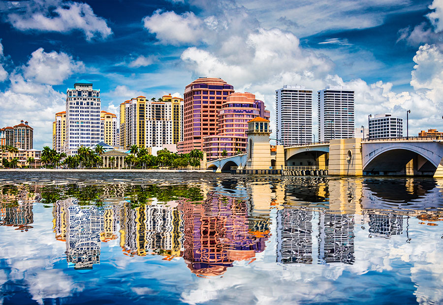 West Palm Beach skyline and waterfront reflected in the Intracoastal Waterway.