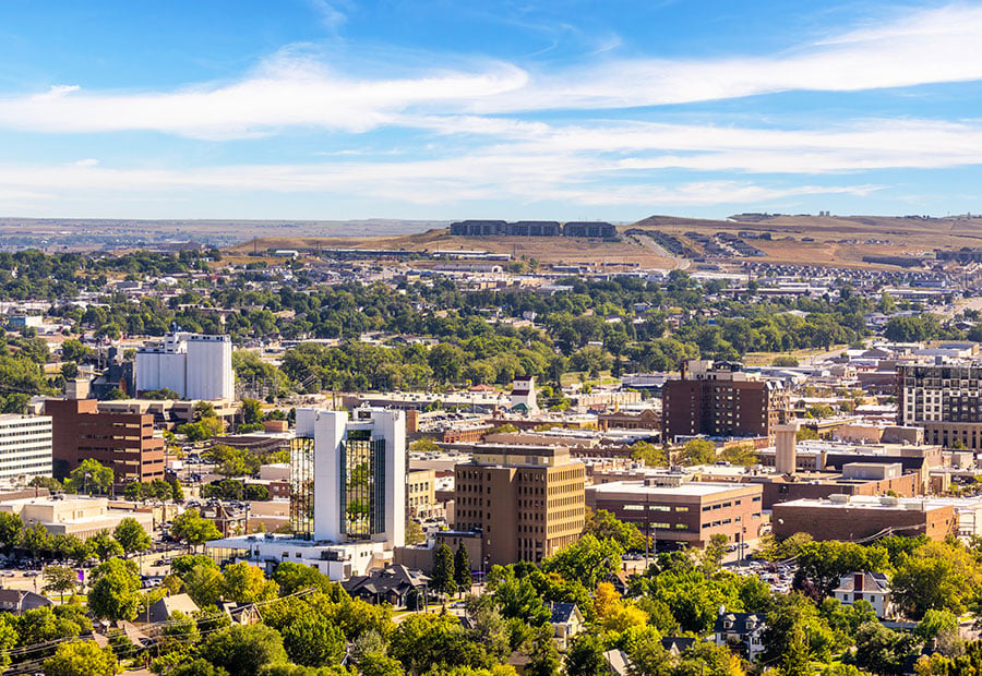 Downtown Rapid City with the Black Hills in the background.