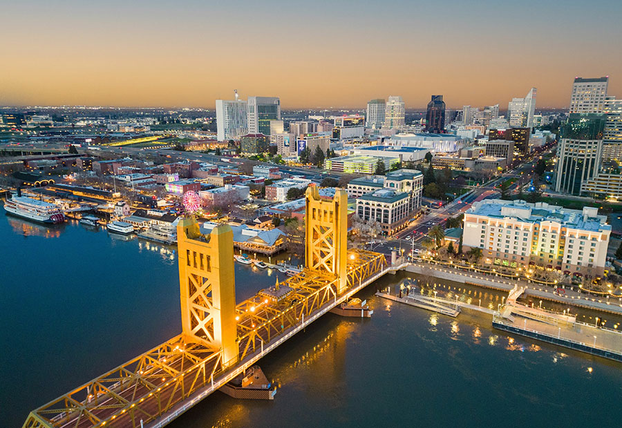 Tower Bridge and downtown Sacramento at dusk.