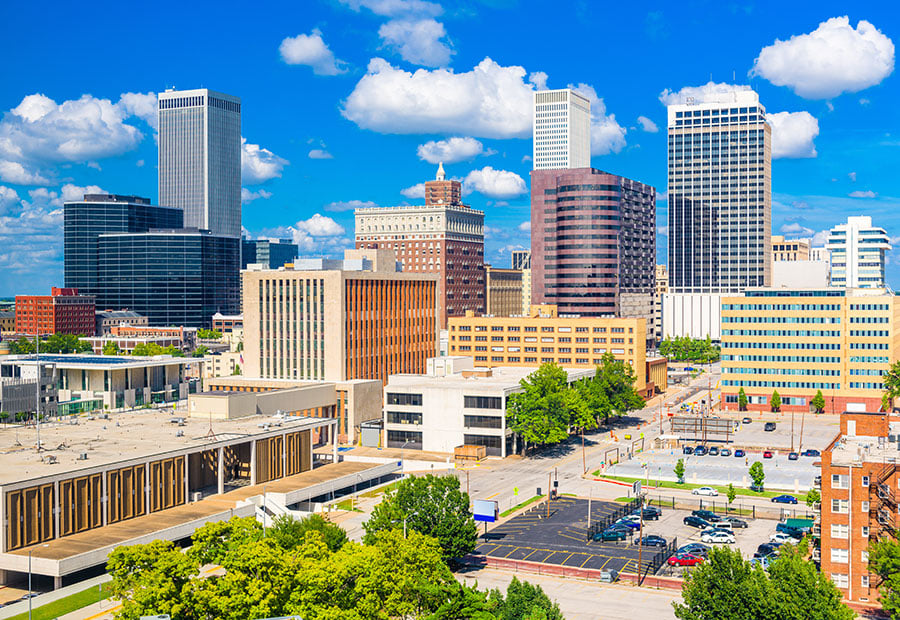 Downtown Tulsa skyline under a blue sky.