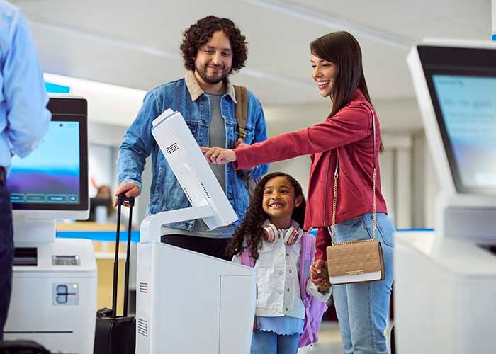 Family at self-service kiosk.