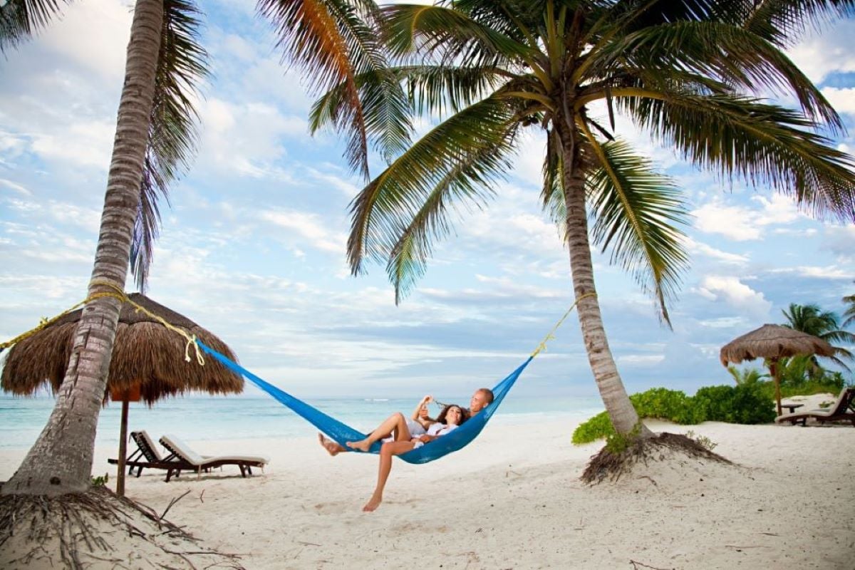 Couple enjoying a tropical beach getaway