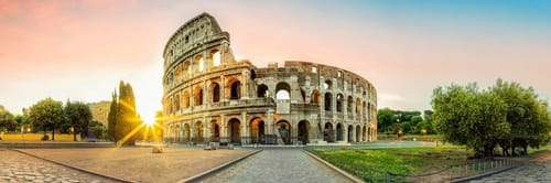 The Colosseum in Rome, Italy, captured during sunset or sunrise.
