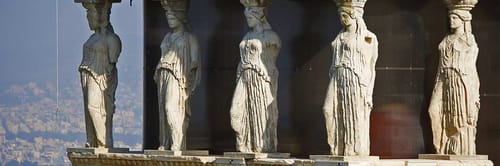 The Caryatids, which are the iconic sculpted female figures serving as columns on the south porch of the Erechtheion, an ancient Greek temple located on the Acropolis of Athens, Greece.