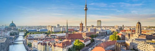 Panoramic view of the Berlin skyline, featuring several prominent landmarks and architectural styles.