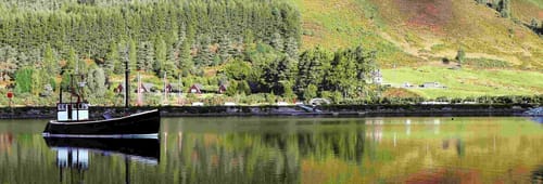 Small boat on Loch Ness in Scotland