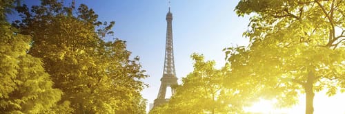 Eiffel Tower in Paris, France, bathed in sunlight