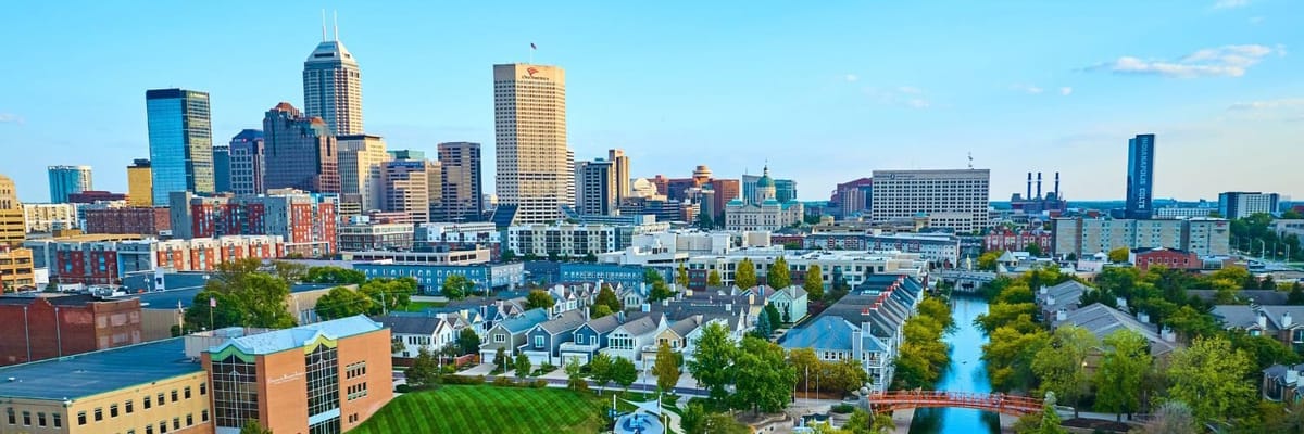 Indianapolis skyline, featuring prominent buildings like the Salesforce Tower, OneAmerica Tower and PNC Center