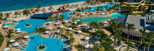 Aerial view of resort, water park, pools and beach at Dreams Natura