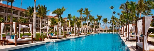 Pool area with cabanas at Secrets Royal Beach Punta Cana