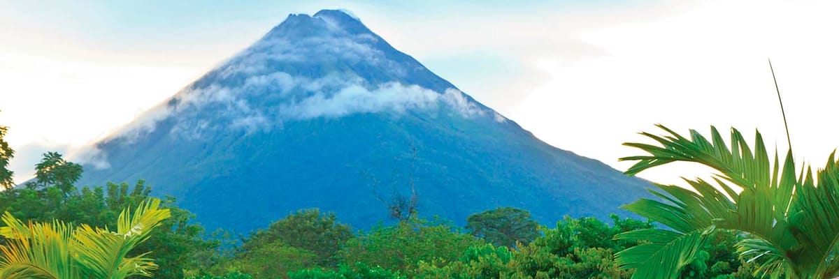Bright foliage in front of Arenal Volcano