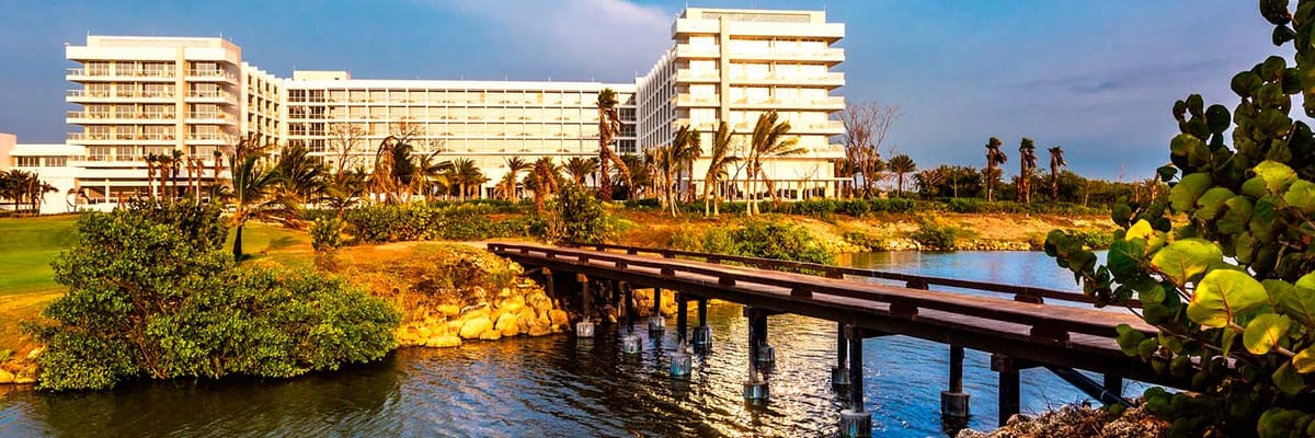 Exterior of Dreams Karibana Cartagena resort with mangrove and walking bridge