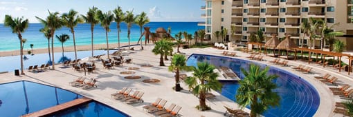 Aerial view of resort, pools, and ocean at Dreams Riviera Cancun Resort & Spa