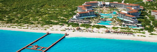 Distant oceanfront aerial view of Dreams Playa Mujeres Golf & Spa Resort