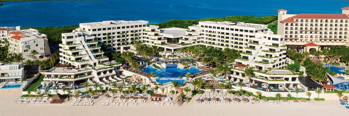 Distant oceanfront aerial view of resort and pools at Now Emerald Cancun