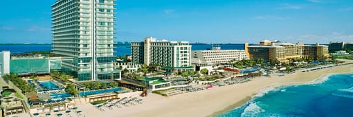 Distant oceanfront aerial view of Secrets The Vine Cancun