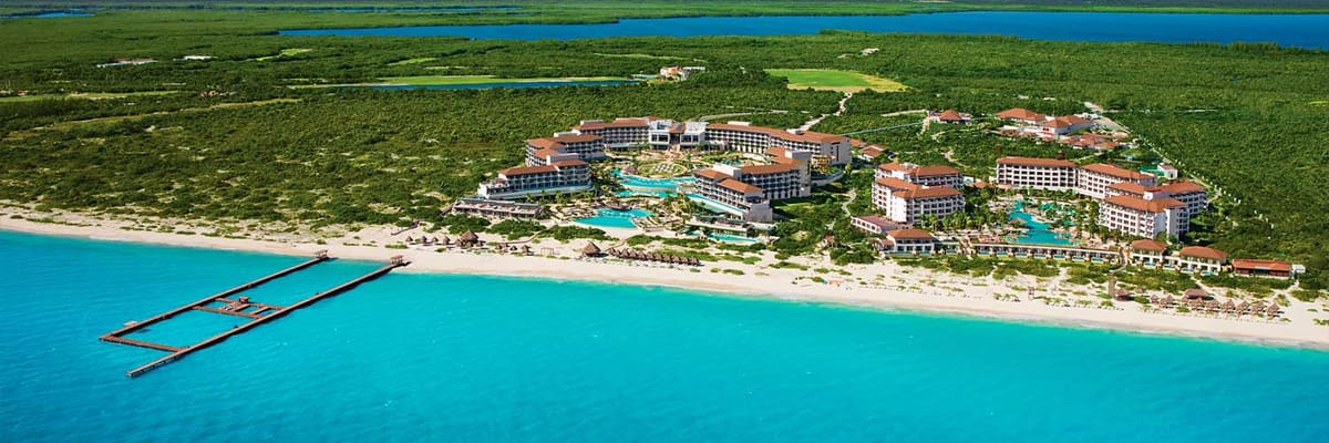 Distant oceanfront aerial view of Secrets Playa Mujeres Golf & Spa Resort