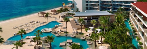 Aerial view of resort exterior and pool at Secrets Riviera Cancun Resort & Spa