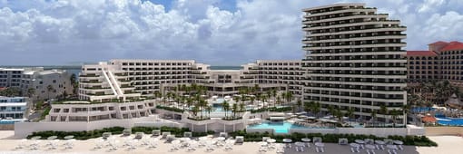 Distant oceanfront aerial view of resort and pools at Secrets Mirabel Cancun
