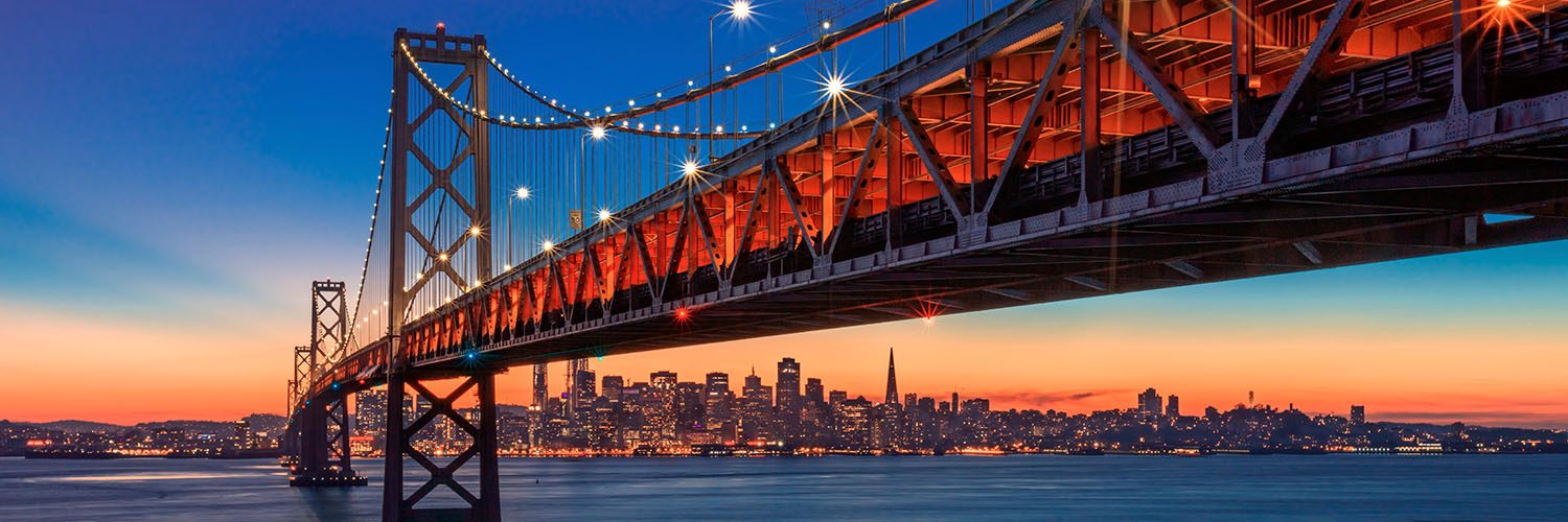 View of San Francisco and Oakland Bay Bridge at dusk, California USA