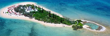 Experience a diverse tropical destination with flights to New Caledonia in under 3 hours from Auckland An aerial view of Ile aux Canards, New Caledonia