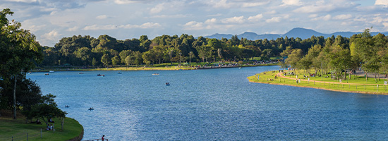 Large urban park with lakes and people relaxing near central Bogotá