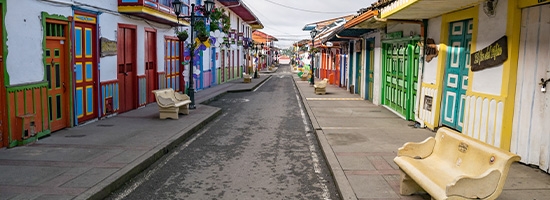  Bright façades and traditional balconies along a street in Salento.