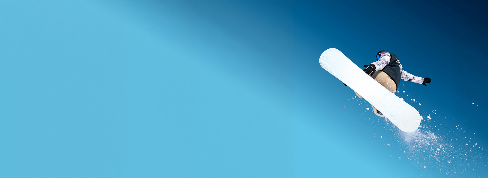 Skier descending snowy mountain