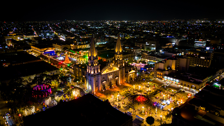 Cathedral of Guadalajara and city center streets illuminated at night.