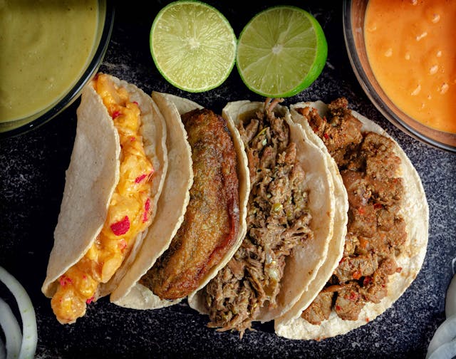 Served tacos with different seasonings.