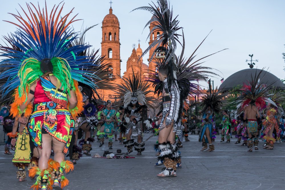 Dancers in traditional costumes in front of the Basilica de Zapopan.