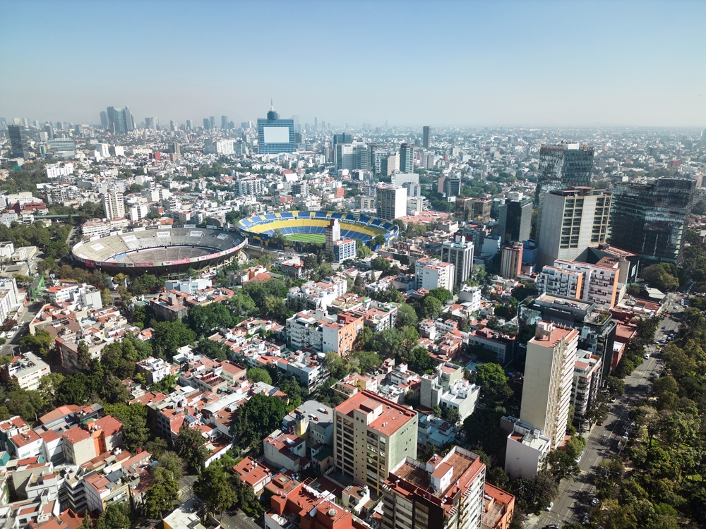 Aerial panoramic views of the neighborhoods of Mexico City and the Plaza de Toros México.