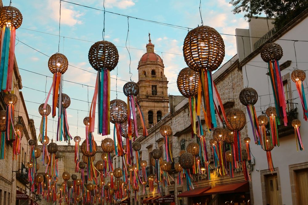 Charming decorations hanging over the pedestrian street Cerrada de San Agustín, in the historic center of Morelia.