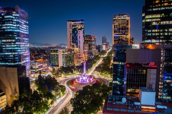 Aerial view of Plaza de la Reforma and Mexico City’s skyscrapers at night.