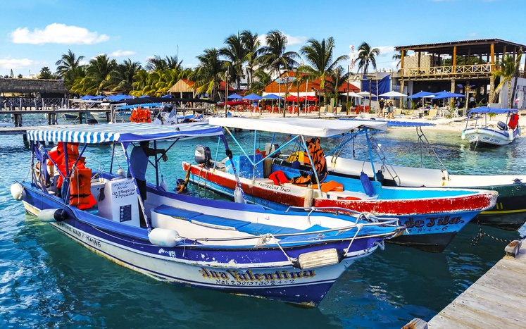 Ferries and boats arriving at Isla Mujeres.