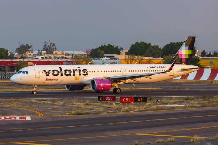 Volaris airbus sliding across the airport platform.