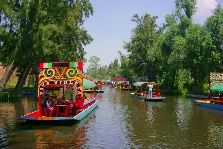 Trajineras sailing at Xochimilco lake.