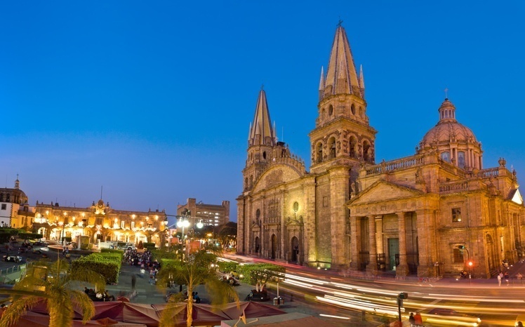 Guadalajara’s Cathedral and buildings in the historic center at night.