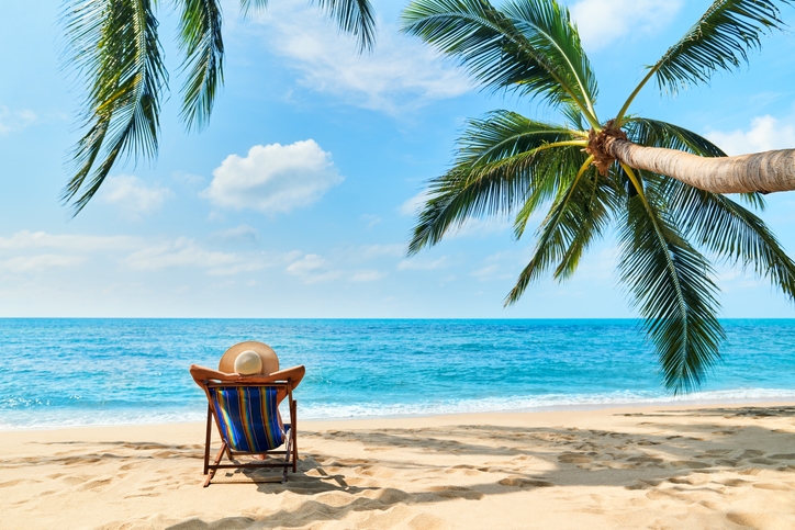 A woman sunbathing by the shore at Isla Mujeres.