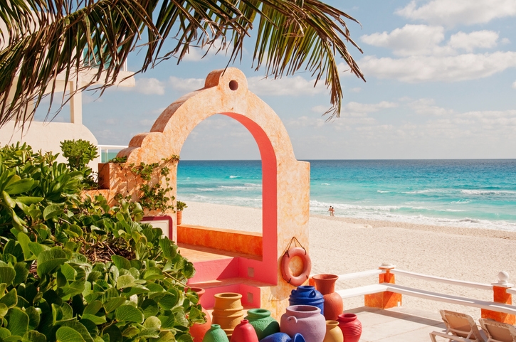 Colorful ceramic vessels at craft shop near the beach.
