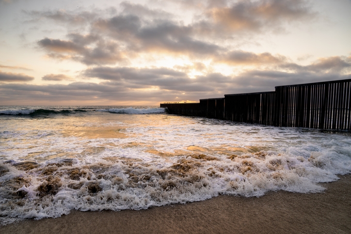 Tijuana beach shore near the international border wall.